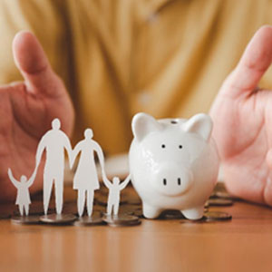 Paper made family with piggy bank, symbolizing savings and financial security